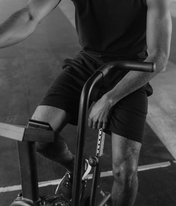 Man performing a strength exercise with focus and energy.